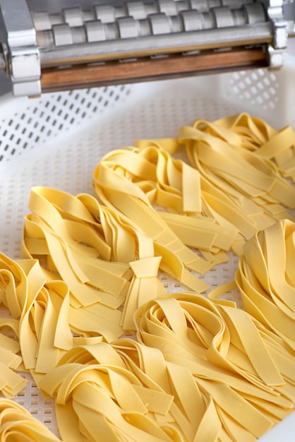 Freshly made ribbons of Italian tagliatelle pasta