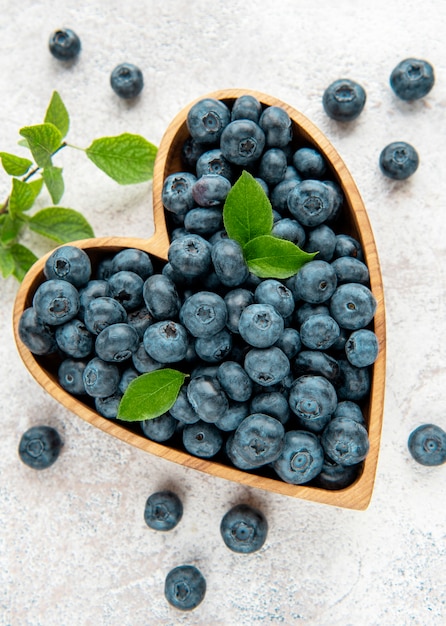 Freshly picked blueberries on a concrete background. Concept for healthy eating