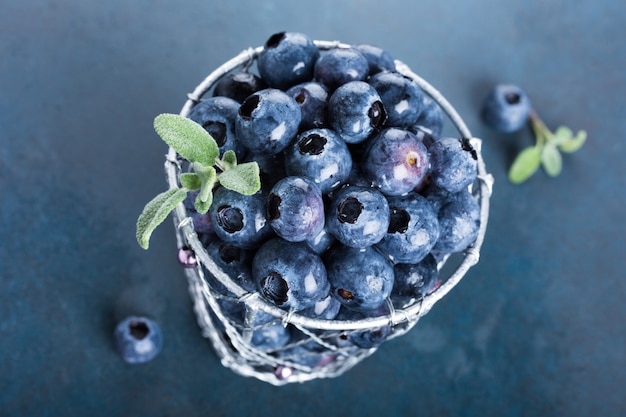 Freshly picked blueberries in metallic cup