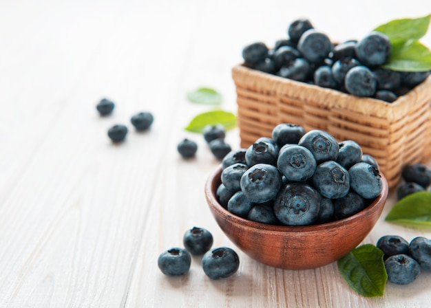 Freshly picked blueberries on a old wooden background. Concept for healthy eating