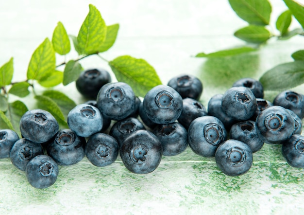 Freshly picked blueberries on a wooden background. Concept for healthy eating