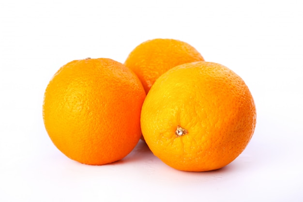 freshly picked citrus fruit on white background,3 Juicy Sweet Oranges