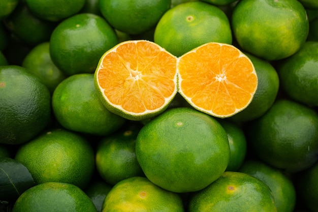 Freshly picked green tangerines mandarines clementines citrus oranges