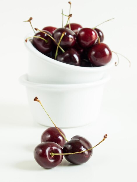 Freshly picked heap of cherries in bowl.