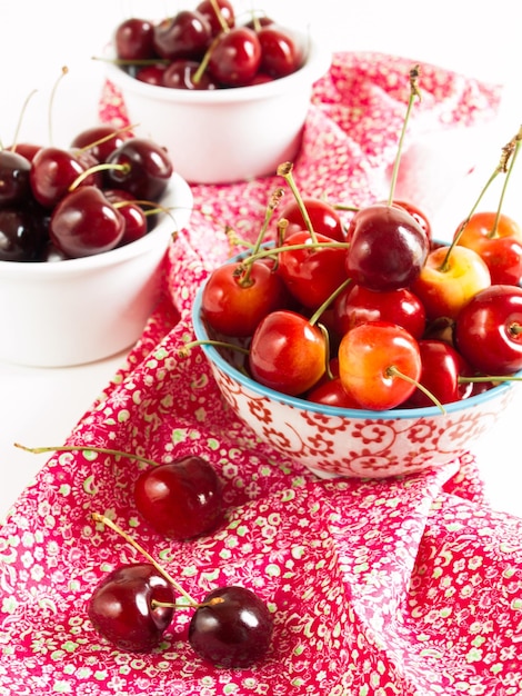 Freshly picked heap of cherries in bowl.