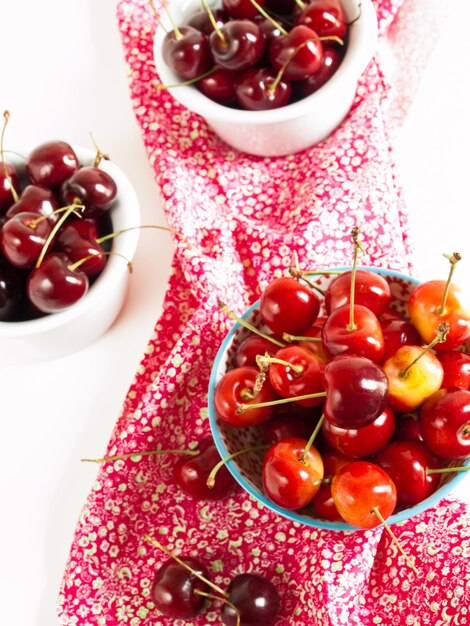 Freshly picked heap of cherries in bowl.