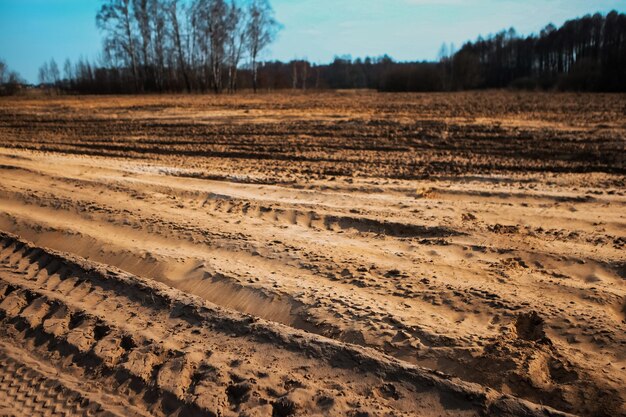 freshly plowed field in early spring tractor marks virgin soil