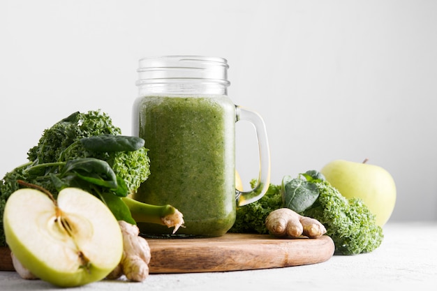 Freshly prepared jar of green smoothie, close up.