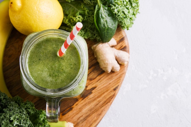 Freshly prepared jar of green smoothie, close up.