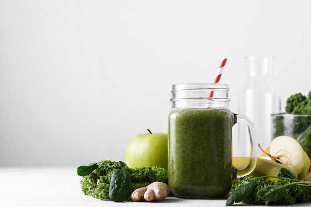 Freshly prepared jar of green smoothie, close up.