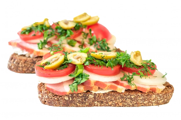 Freshly prepared sandwich with ham isolated on white.