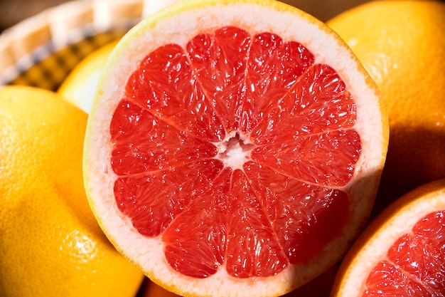 Freshly red grapefruits on wooden surface