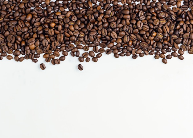 Freshly Roasted Coffee Top View of Beans on White Background for Organic Java Concept