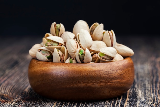 Freshly roasted pistachio nuts in salt, toasted crispy pistachios sprinkled with salt