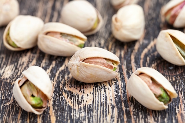 Freshly roasted pistachio nuts in salt, toasted crispy pistachios sprinkled with salt