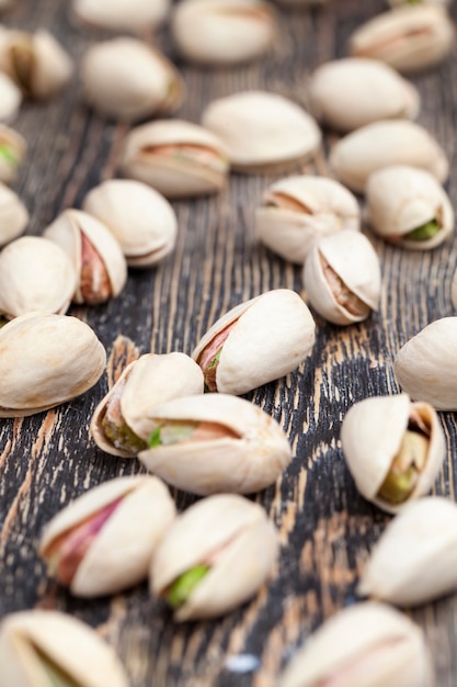 Freshly roasted pistachio nuts in salt, toasted crispy pistachios sprinkled with salt