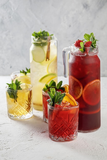 Freshly summer drinks lemonades isolated on white concrete background