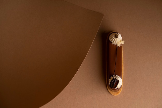 A freshlybaked cake sits atop a table surrounded by sheets of parchment pape