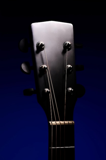 The fretboard of an acoustic guitar closeup Studio photo of a musical instrument Mockup