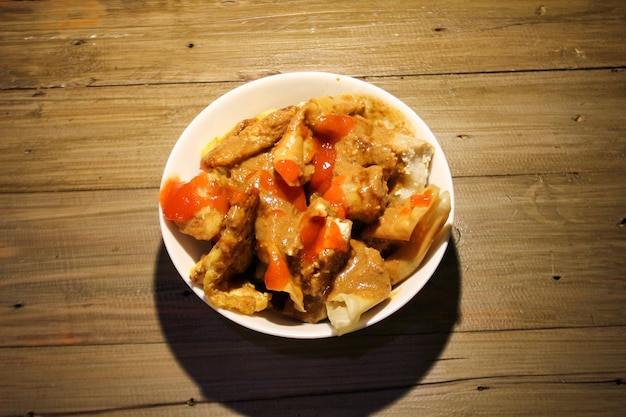 fried batagor on a white bowl