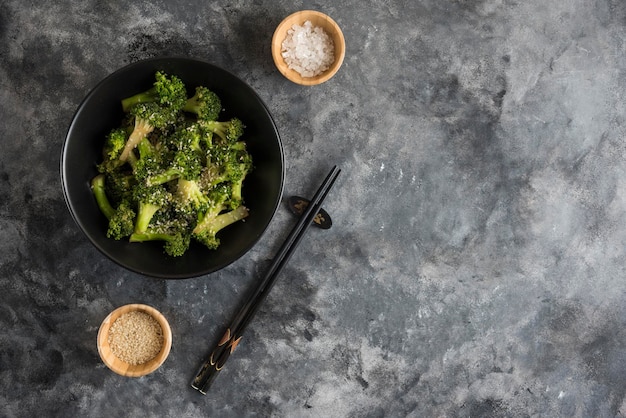 Fried broccoli on dark background compositions