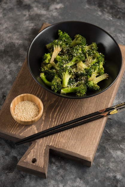 Fried broccoli on wood cutting board composition