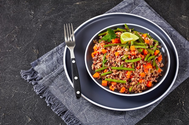 Fried brown rice with green beans and carrot