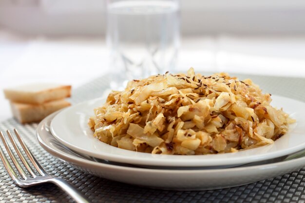 Fried cabbage with caraway and garlic on a plate