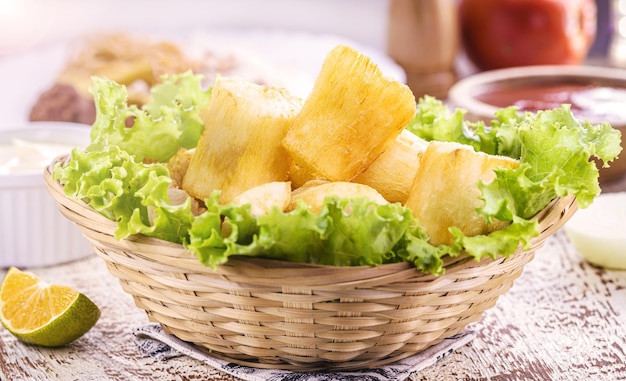 Fried cassava snack made from cassava root and served fried with lettuce traditional south american restaurant food garnish brazilian restaurant food