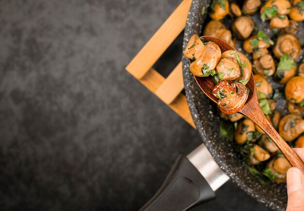 Fried champignons with chopped parsley