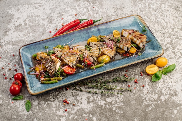 Fried cheese tofu with vegetables and herbs