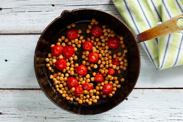 Fried cherry tomatoes with chickpeas