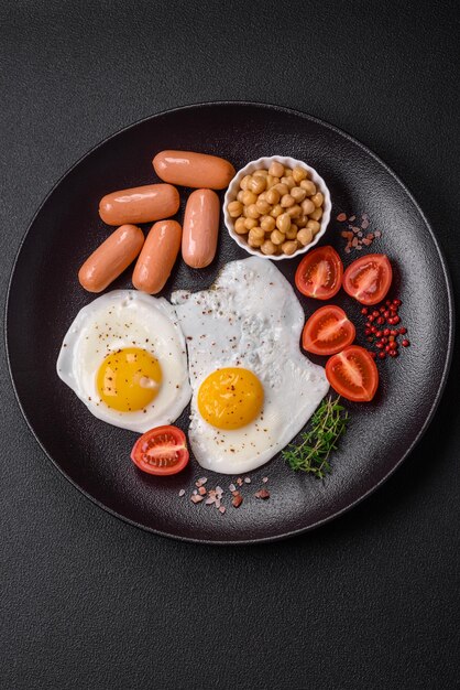 Fried chicken eggs sausages cherry tomatoes chickpeas spices salt