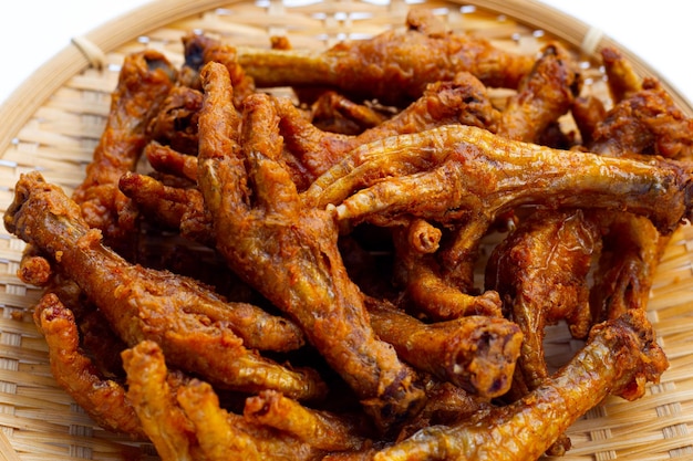 Fried chicken feet in bamboo basket