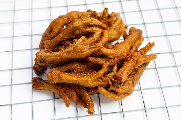 Fried chicken feet on white background