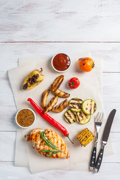 Fried chicken fillet and grilled vegetables