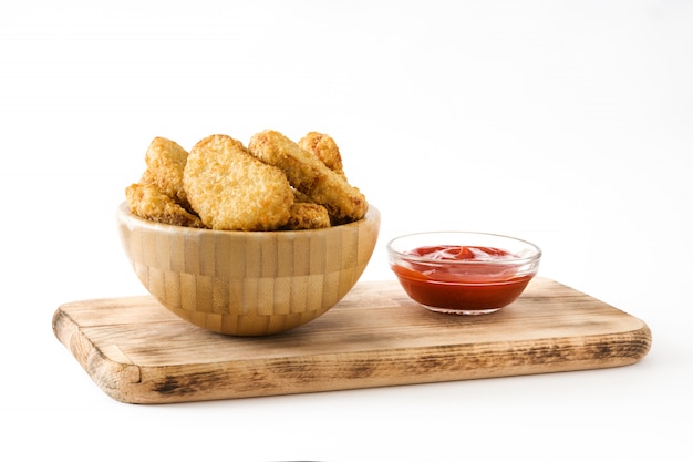 Fried chicken nuggets in bowl isolated on white