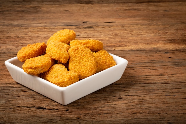 Fried chicken nuggets with ketchp and rose sauce