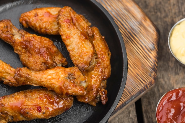 Fried chicken on plate with variety of sauces