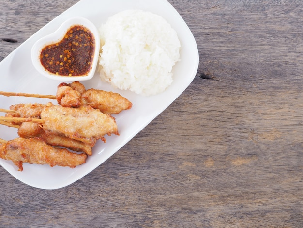 Fried chicken skewers with spicy sauce 