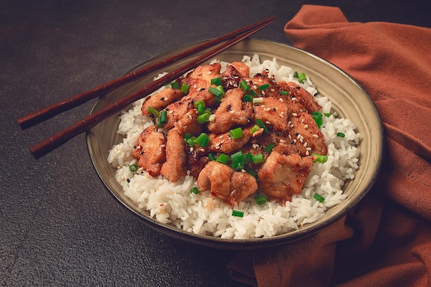 fried chicken teriyaki with rice green onion and sesame homemade no people