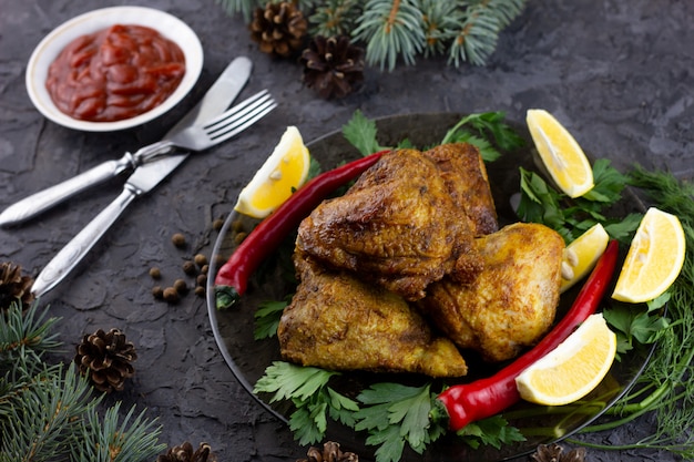 Fried chicken thighs for the holiday table. cooked chicken\
thighs for new year holidays, homemade food