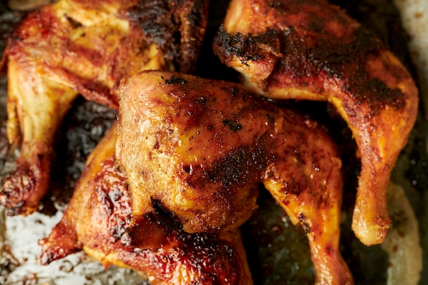 fried chicken thighs with a crispy crust on a baking sheet closeup fried chicken thighs