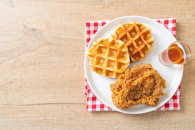 Fried chicken waffle with honey or maple syrup