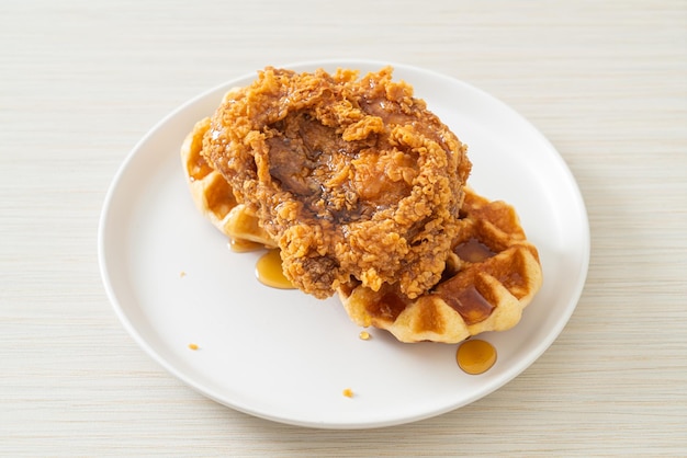 Fried chicken waffle with honey or maple syrup