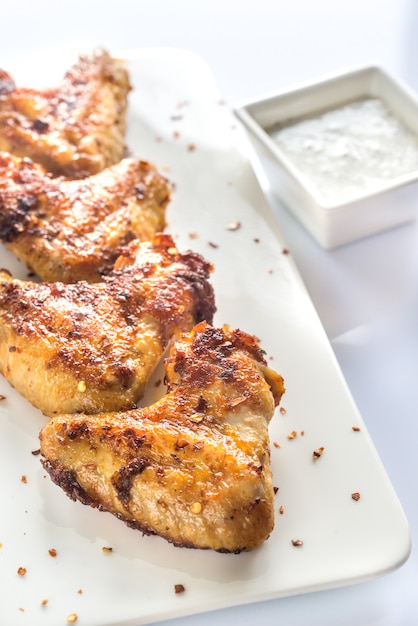 Fried chicken wings on the white plate