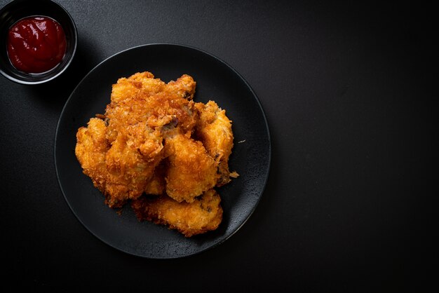 fried chicken wings with ketchup - unhealthy food