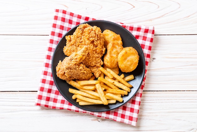 fried chicken with french fries and nuggets meal