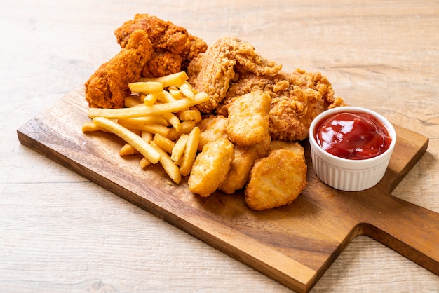 fried chicken with french fries and nuggets meal