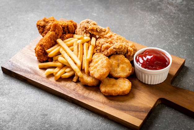 fried chicken with french fries and nuggets meal